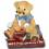 Deko - Figur Teddy mit Sonnenbrille sitzt auf einem Buch