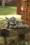 Gartenfigur Troll Faulenzer mit Blume TYR