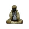 Sitzender Buddha betrachtet eine...